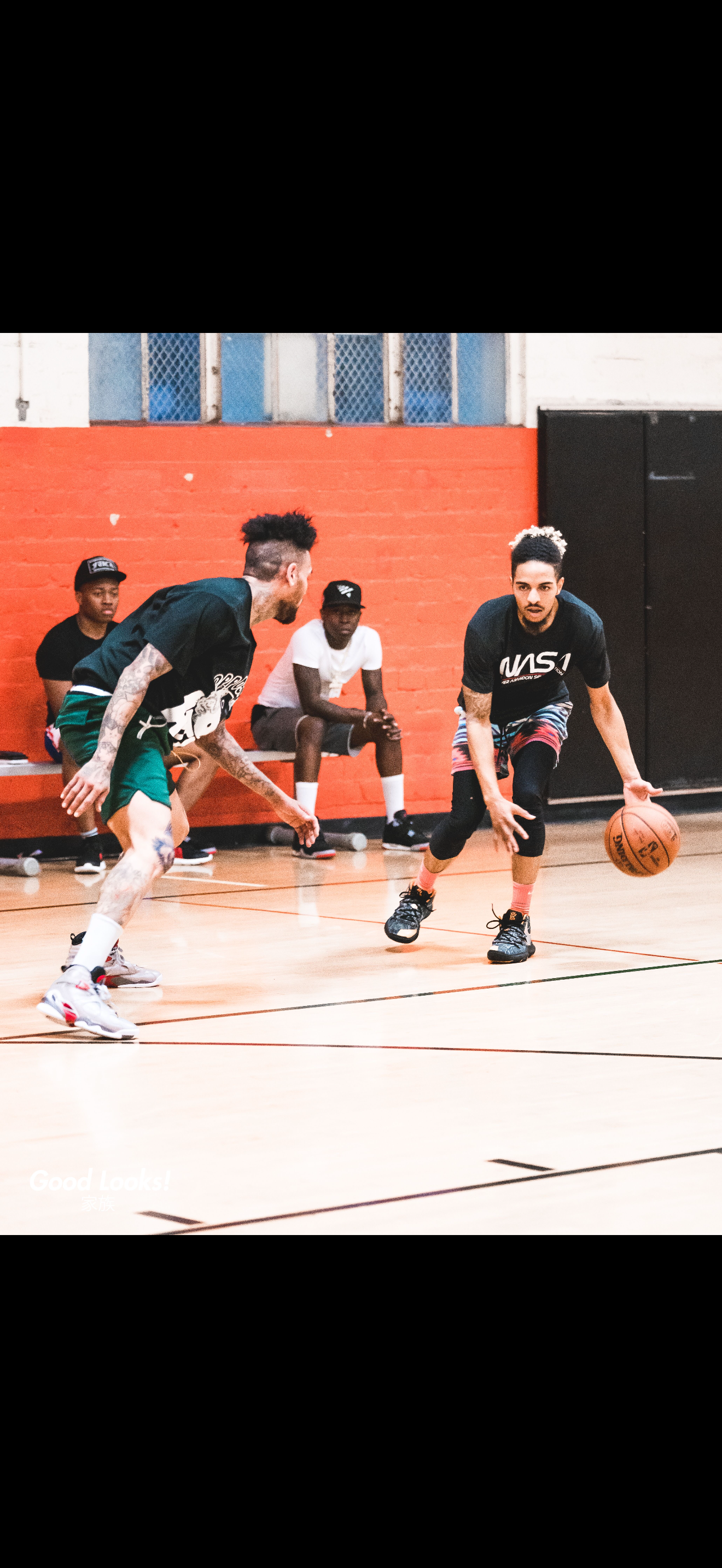 Basketball training session with Andre Winn and young athletes in the gym.