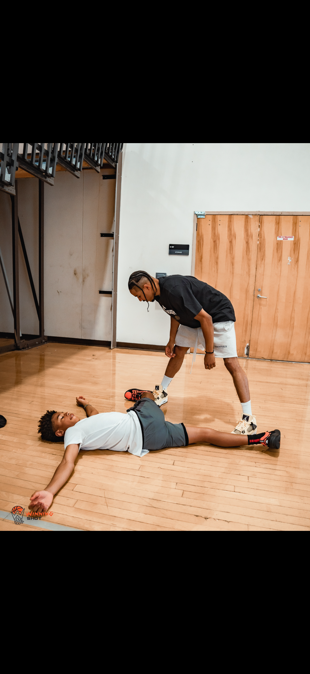 Athlete progression and ball-handling work in the training space.