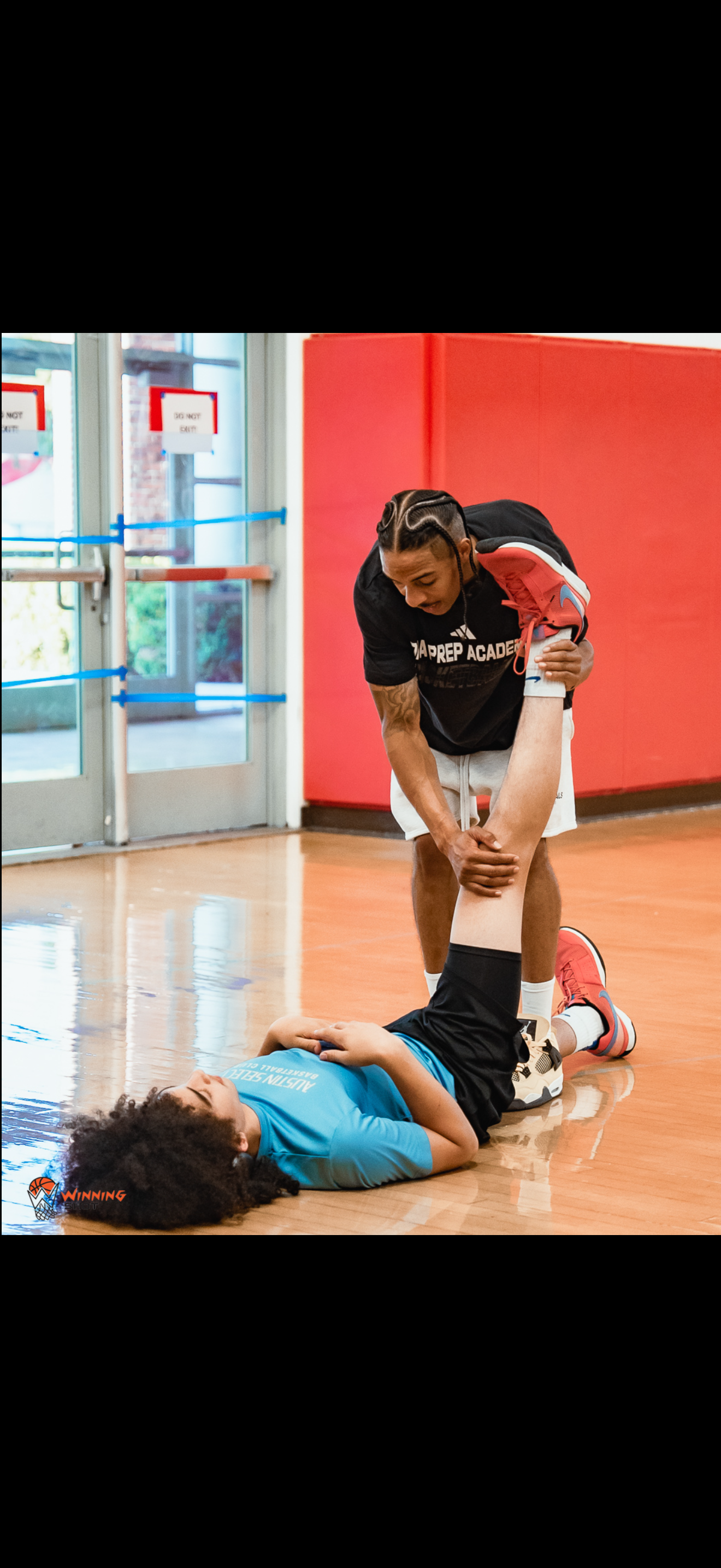 Training photo showing WE TRAIN TO WINN athletes working in the gym.